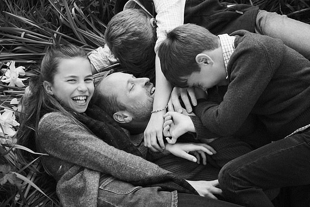 William is embraced by his children Prince George, Princess Charlotte and Prince Louis in the Waleses Father's Day post