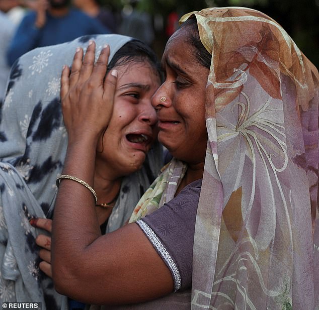 Dabu Patni cries upon hearing the news of her brother Akash Patni, who died when the Air India Boeing 787 Dreamliner plane crashed in Ahmedabad, India, June 12, 2025