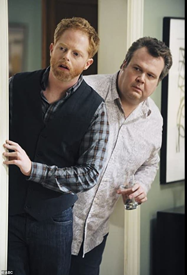 The Modern Family star, 49, explained: ' I was caught stealing pornography when I was very young. Not very young, but like early teens' (pictured alongside his co-star Eric Stonestreet)
