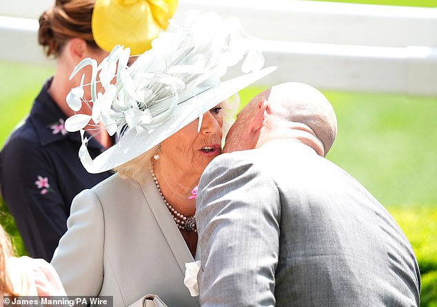 Queen Camilla was given a kiss on the cheek as she was greeted by Mike Tindall