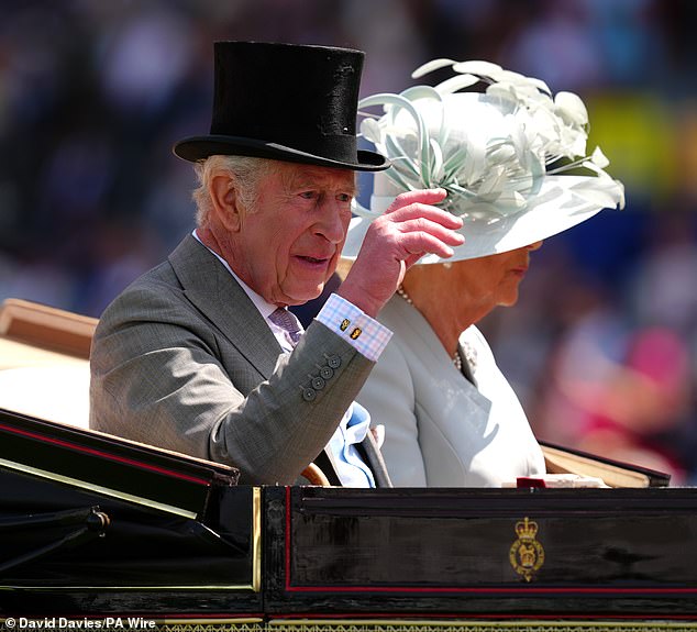 The monarch appeared in great spirits as he tipped his hat to the crowd and waved