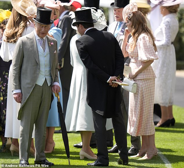 King Charles III speaks with Edoardo Mapelli Mozzi and Princess Beatrice ahead of the Queen Anne Stakes