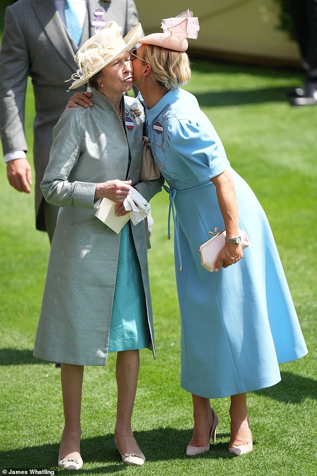A kiss for mum! Zara affectionately greets her mother, The Princess Royal, at Ascot
