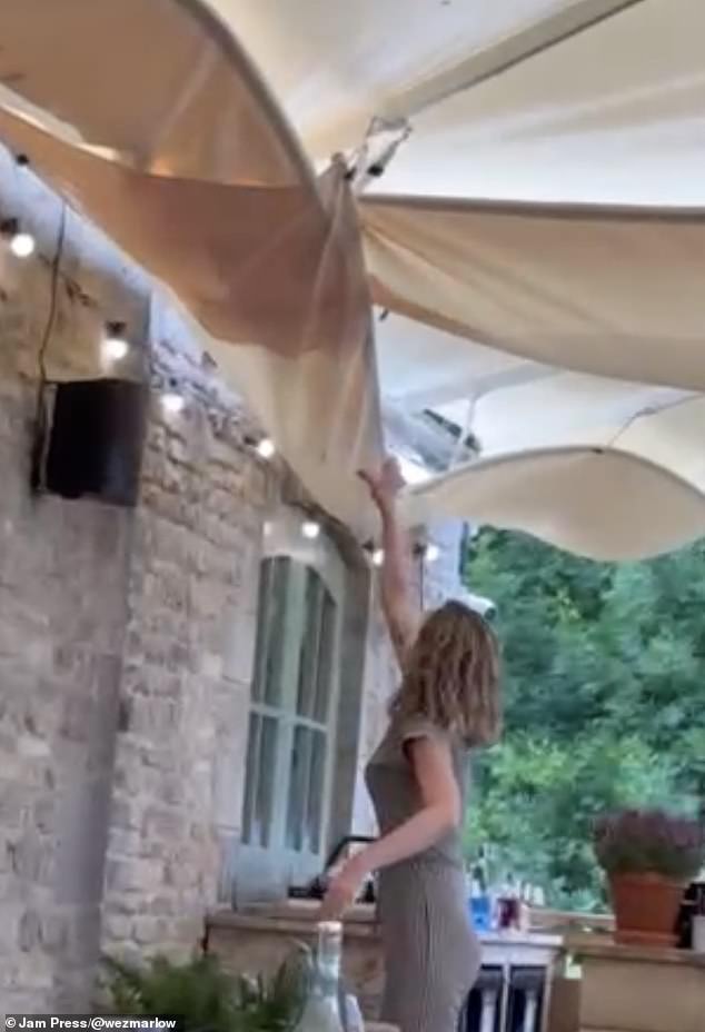 Footage shows workers scrambling to drain some of the water as they got splashed in the process