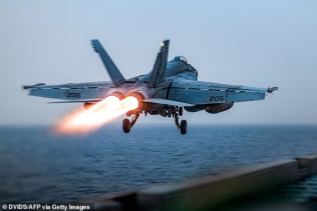 A US F/A-18 Super Hornet attack fighter jet taking off from the US Navy's Nimitz-class USS Harry S. Truman aircraft carrier at sea on March 16, 2025