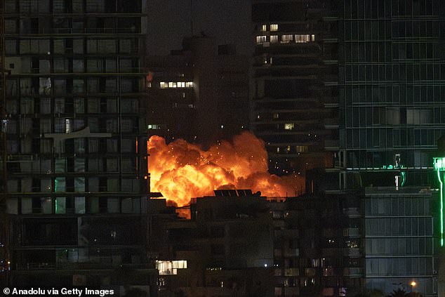 Smoke and flame rise after Iranian strikes hit a building as Iran's ongoing retaliatory attacks with ballistic missiles towards Israel are seen from Tel Aviv, Israel on June 16, 2025