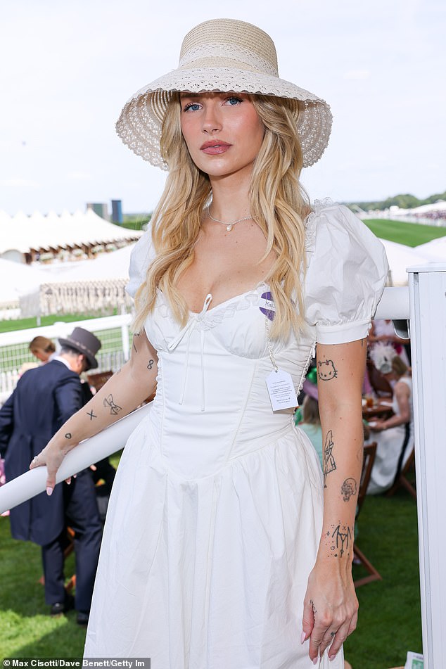 Lottie stunned in her stylish white dress from House Of CB as she arrived for the first day of the annual racing event