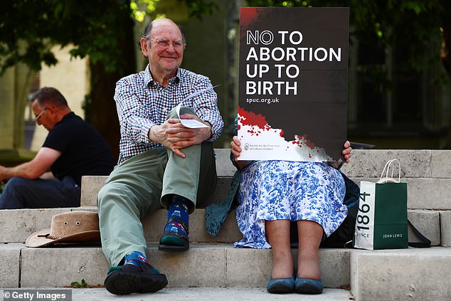 Protesters from pro-life group 'Christian Concern' gather near Parliament, as MPs vote on the decriminalisation of abortion on June 17