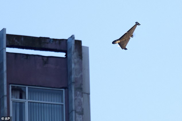 A Russian drone attacks a building during Russia's massive missile and drone air attack in Kyi
