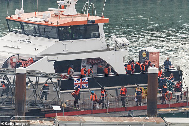 Migrants arrive at Dover Port after being picked up by a Border Force vessel in the English Channel on September 21 (file photo)