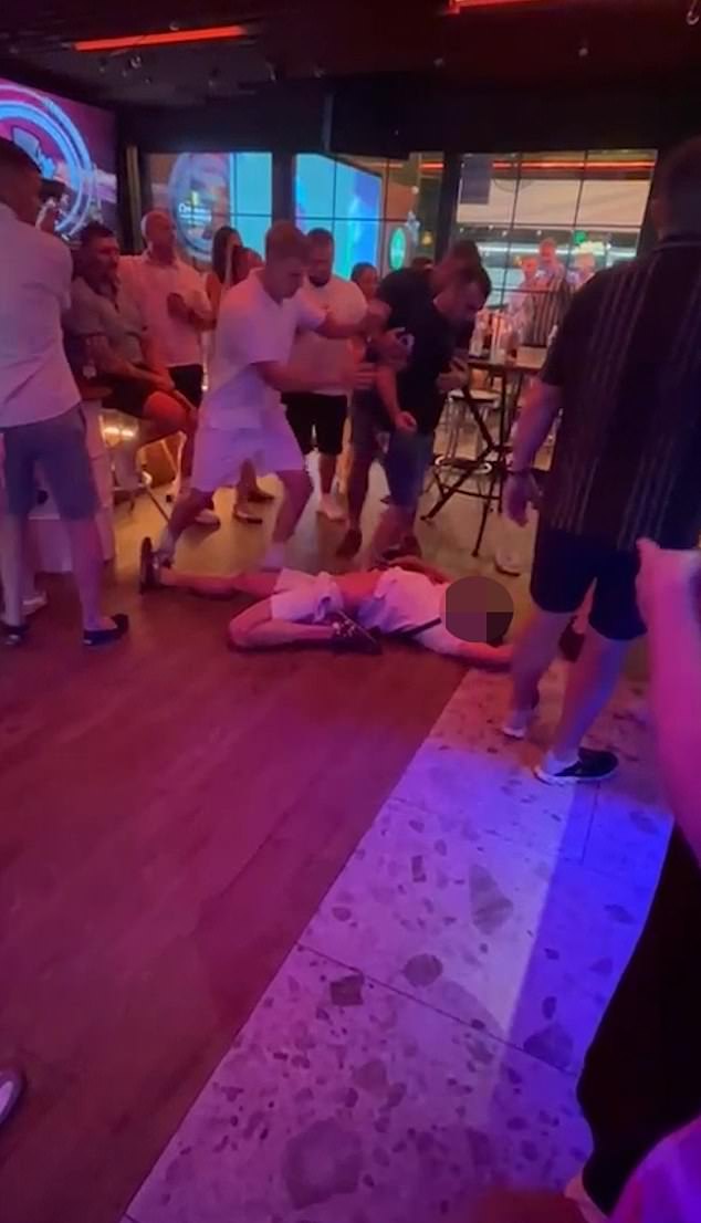 The video shows the man being brutally punched in the face and falling on the floor, as his leg bends backwards towards his hip