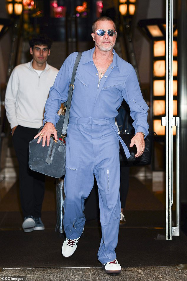 Brad ¿ who recently underwent a midlife crisis makeover ¿ sported a blue Gucci jumpsuit
