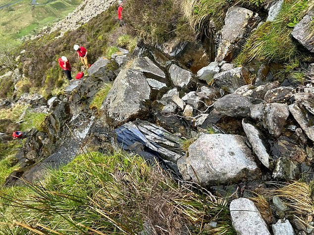 In the same gully (above), hidden under thick undergrowth and debris, were the remains of another man
