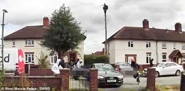The gang of thugs sprint away from the scene following the killing, which took place in daylight on a residential road