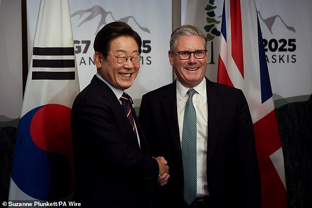 Prime Minister Sir Keir Starmer and South Korean President Lee Jae-myung shake hands during the meeting on Tuesday