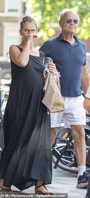 Kayte showed off her bump during an outing with her family in London on Tuesday