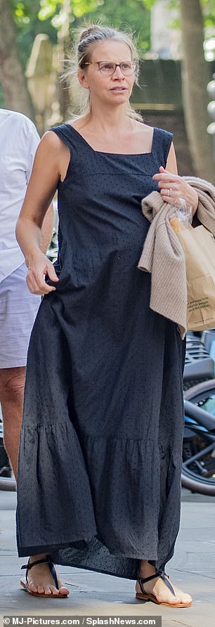 Walsh kept her cool with sandals while her husband trekked through the city in trainers