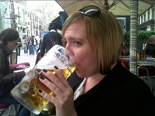 Amy, pictured drinking a beer, drank up to four bottles of wine a day