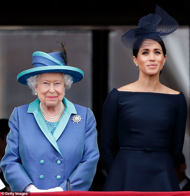 The late Queen in 2018, smiling with Meghan Markle