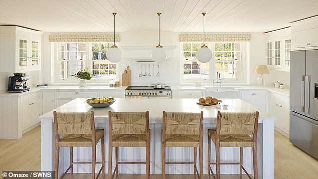The kitchen at the imposing house, which was built in the style of architecture found in Cape Cod and the Hamptons, boasts integrated appliances, a US-style fridge and an island with seating for four people
