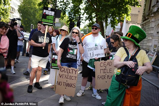Hundreds of demonstrators gather to show their support outside the court in Central London
