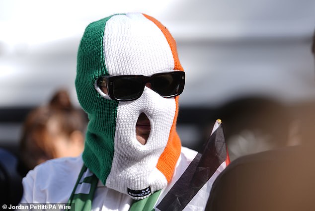 A supporter of Kneecap's Liam Og O Hannaidh outside Westminster Magistrates' Court today