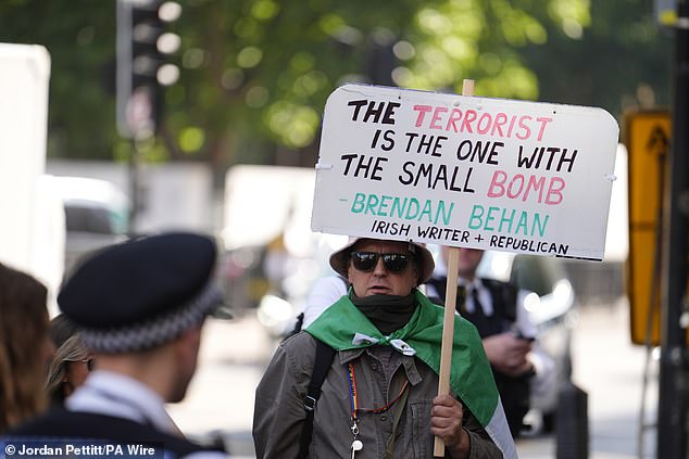 A supporter of Kneecap's Liam Og O Hannaidh outside Westminster Magistrates' Court today