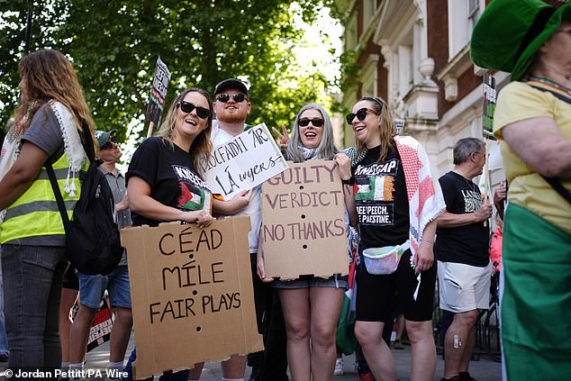 Hundreds of demonstrators gather to show their support outside the court in Central London