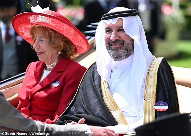 Lady Sarah Keswick and Prince Faisal, a member of the Saudi royal family, attend day one of Royal Ascot