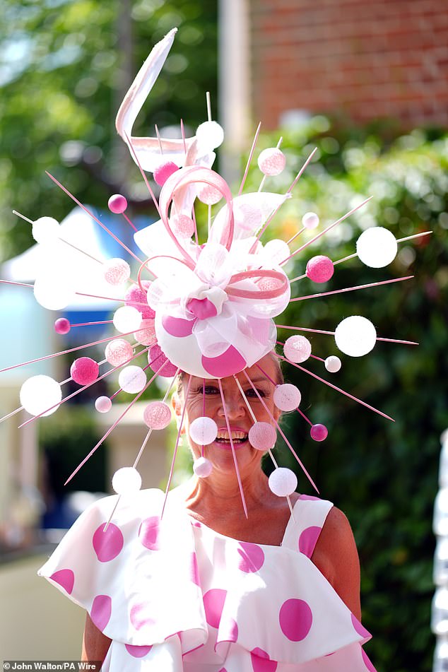 Spot on! This woman made sure to stand out from the crowd with her eye-catching headpiece