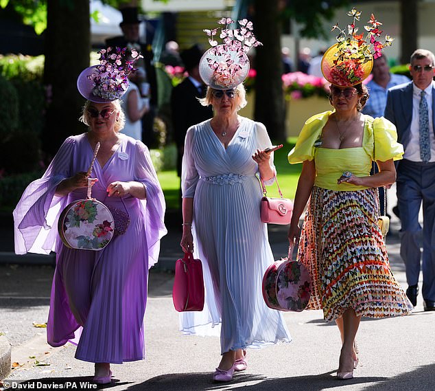 Working it: These racegoers put their best fashion foot forward as they attended Day Two of Royal Ascot