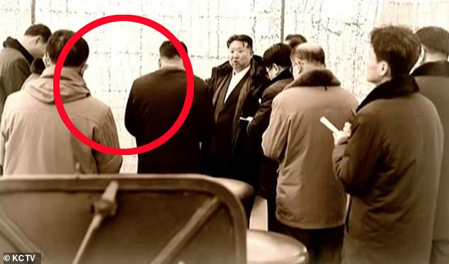 Navy Commander Admiral Kim Myong Sil and and shipyard boss Hong Kil Ho were airbrushed from images showing them with their leader back in March