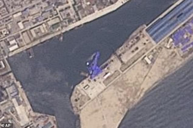 This satellite image from Planet Labs PBC shows a blue tarp covering a North Korean destroyer after it suffered a failed launch while it was being put to sea in Chongjin on May 22