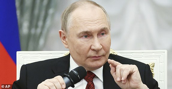 FILE - Russian President Vladimir Putin speaks at the Kremlin in Moscow, Russia, on Thursday, June 12, 2025, with participants of the Time of Heroes, an educational program for veterans of the conflict in Ukraine. (Sergei Bulkin, Sputnik, Kremlin Pool Photo via AP, File)