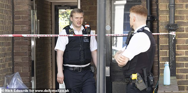 The house was cordoned off by police investigating the crime scene and collecting forensic evidence
