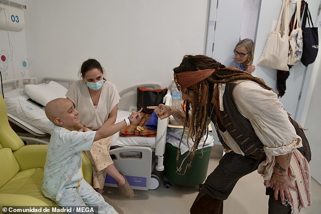 While dressed as his beloved Pirates of the Caribbean character, the movie star, 62, surprised kids, adolescents and their families while touring the oncology area of the health center