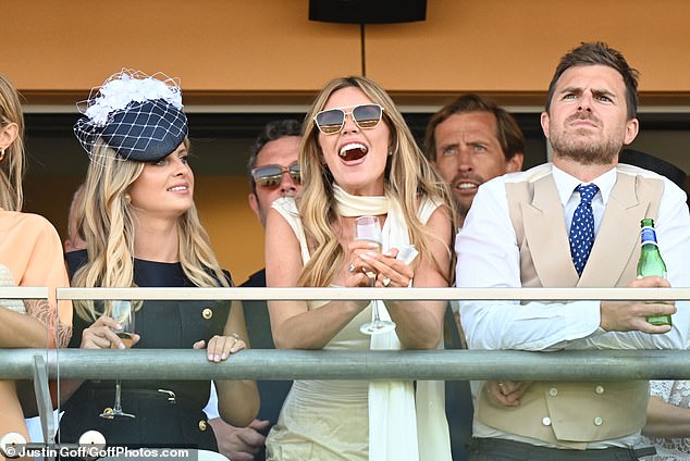 As she watched the racing unfold with her pals, Abbey was in high spirits