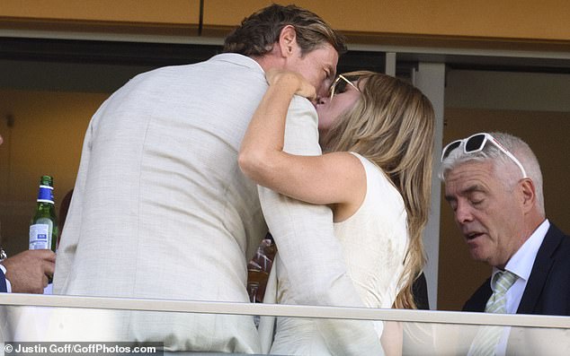 After heading up to the balcony, Abbey cosied up to her dapper husband as they enjoyed their outing at the races together
