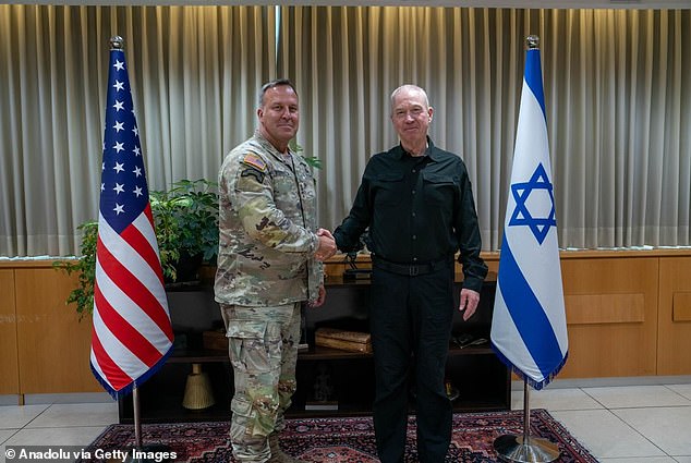 Kurilla shaking hands with Israeli Defense Minister Yoav Gallant last year