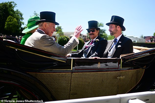 The King (pictured left) waves to the crowd at the second day of Royal Ascot in Berkshire