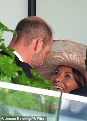 The Prince of Wales greets Carole Middleton during the Queen's Vase on day two of Royal Ascot