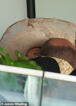 The Prince of Wales greets Carole Middleton during the Queen's Vase on day two of Royal Ascot