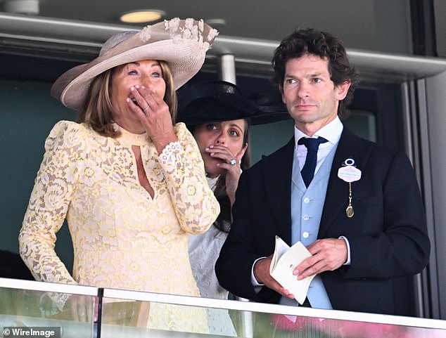 Carole Middleton, dressed in Me+Em's £325 Two Tone Lace-Blend Midi Dress, and Sam Waley-Cohen watching the Queen Mary Stakes on day two of Royal Ascot