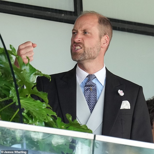 Prince William reacts while watching the racing during the second day of the prestigious festival