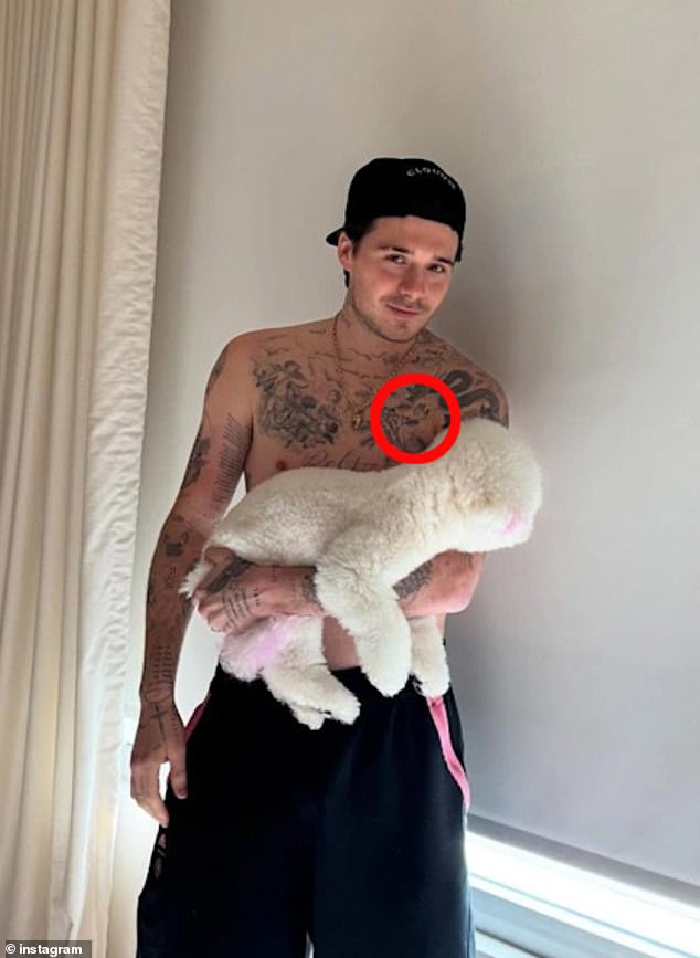 Brooklyn had his 'Mamma's boy' tattoo replaced with an inking of his wife's wedding bouquet (circled) and last week, there was the big reveal of a Peltz-penned love note tattooed on the back of his neck.