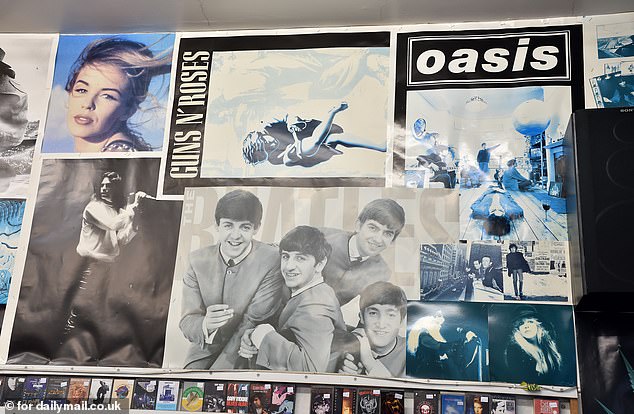 Posters on the walls at Sifters show artists including Guns N' Roses, local boys Oasis and their idols The Beatles