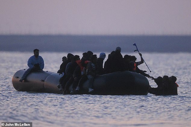 As the sun rose at 5.30am, his crutch was held aloft like Excalibur as his fellow migrants helped him aboard