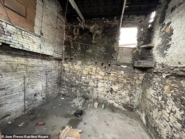 Photos show that behind the boarded up door there is practically nothing there