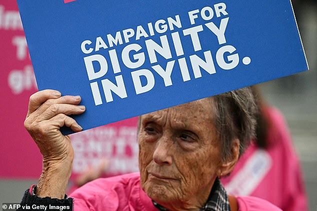 A majority of 55 voted in favour the Bill last year, meaning that 28 would need to switch sides to bring it down, and at least a dozen have publicly turned against it in recent weeks. Pictured: A campaigner from Dignity in Dying protests outside The Palace of Westminster