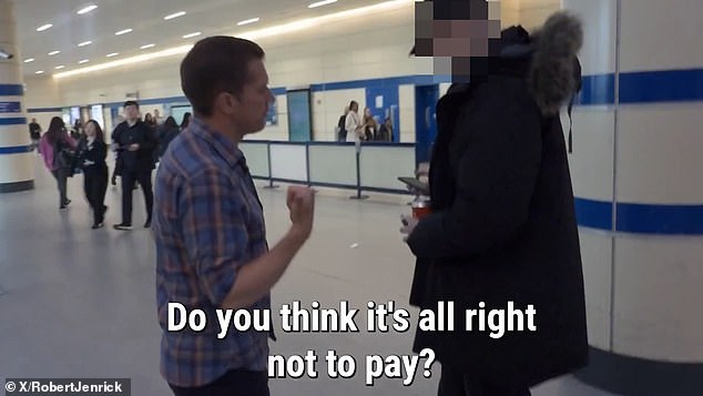 Robert Jenrick confronts people pushing through the barriers at Stratford station in London